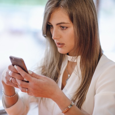https://www.magnific.com/free-photo/stylish-woman-with-serious-face-looking-her-phone_1040822.htm