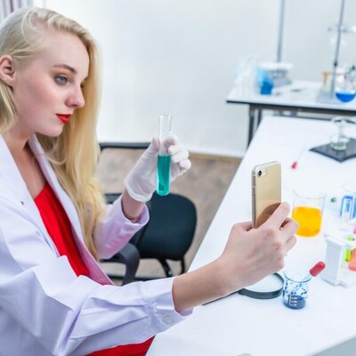 https://www.freepik.com/premium-photo/portrait-female-researcher-carrying-out-research-chemistry-lab-scientist-holding-test-tube-with-sample-taking-selfie-with-focus-smartphone-laboratory-analysis-background_24311237.htm#fromView=search&page=4&position=9&uuid=bf293d46-a902-4bd9-93de-5e429f1ef75b&query=taking+photo+in+laboratorium